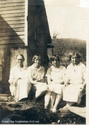 Primilia Gragg,Ruth Collins, Florence Smith and Bertha Galford Seated Outside in Cass